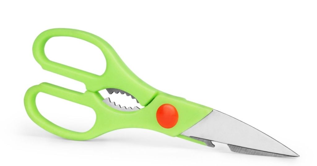 Green kitchen shears with ergonomic design, perfect for versatile cutting tasks like herbs and meats.