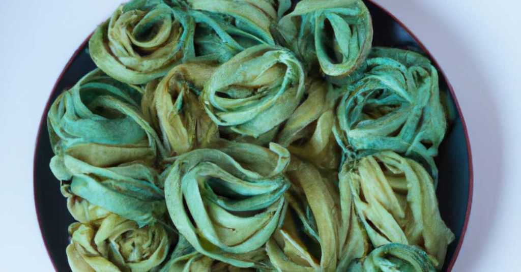 Close-up of dried pasta with a blue-green color, created using butterfly pea flower infusion.