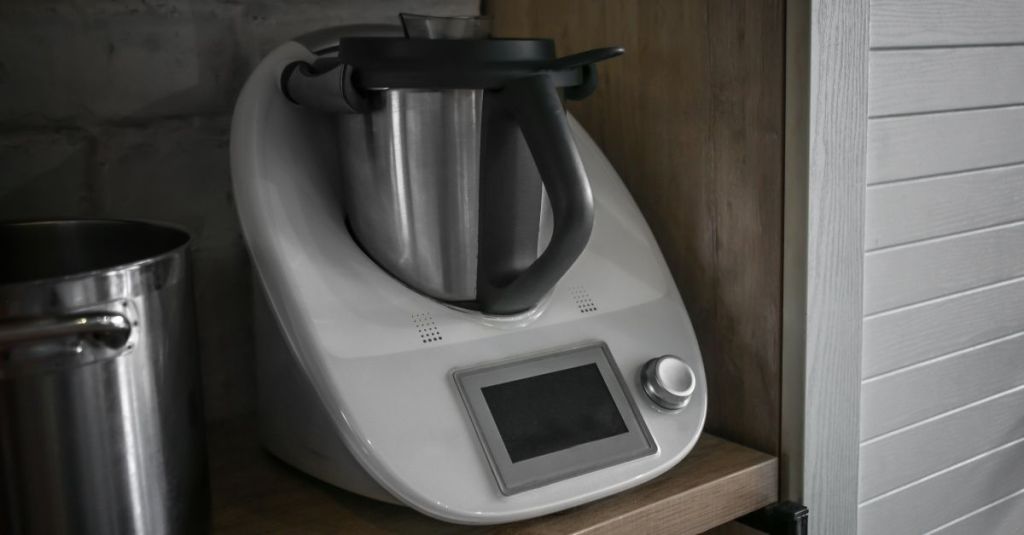Thermomix appliance with a stainless steel container, ideal for various cooking tasks.