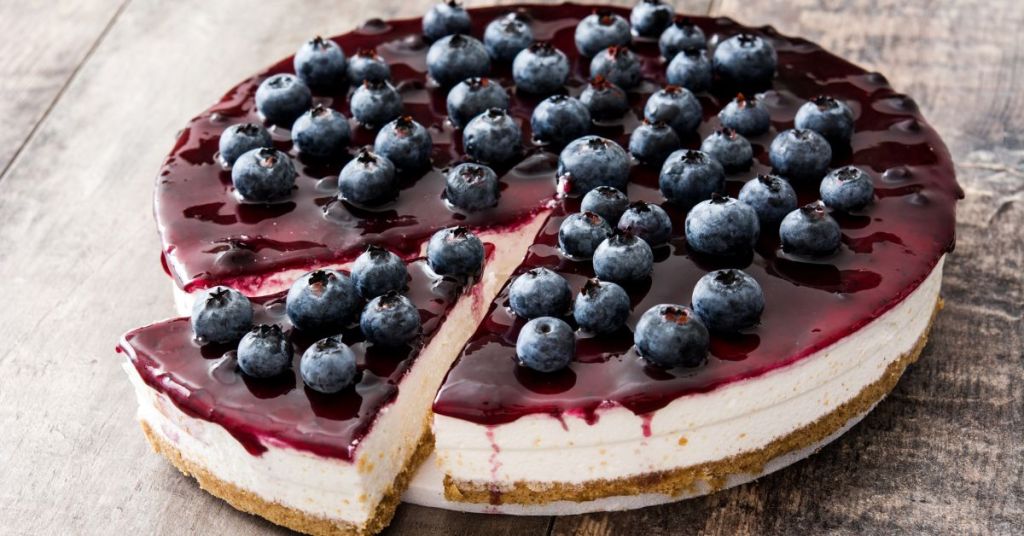 blueberry glazed dessert Whole treat topped with a smooth blueberry glaze and fresh blueberries.