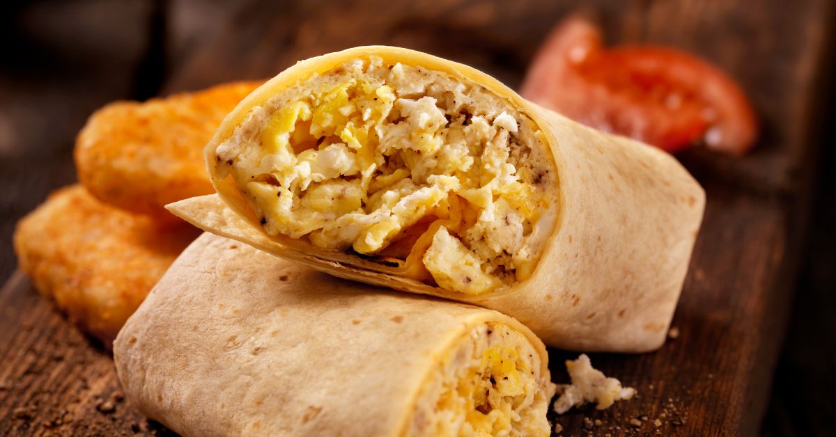 A protein-rich breakfast wrap filled with scrambled eggs and fresh vegetables, ideal for busy mornings. Protein-packed breakfast wraps with eggs and cheese for a quick energy boost in the morning.