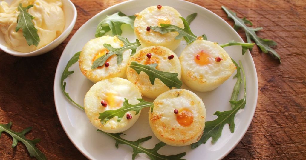 Savory egg cups baked with cheese and vegetables, a convenient prep-ahead breakfast idea. Protein-packed egg cups with diced vegetables and melted cheese, ideal for a portable, healthy breakfast.