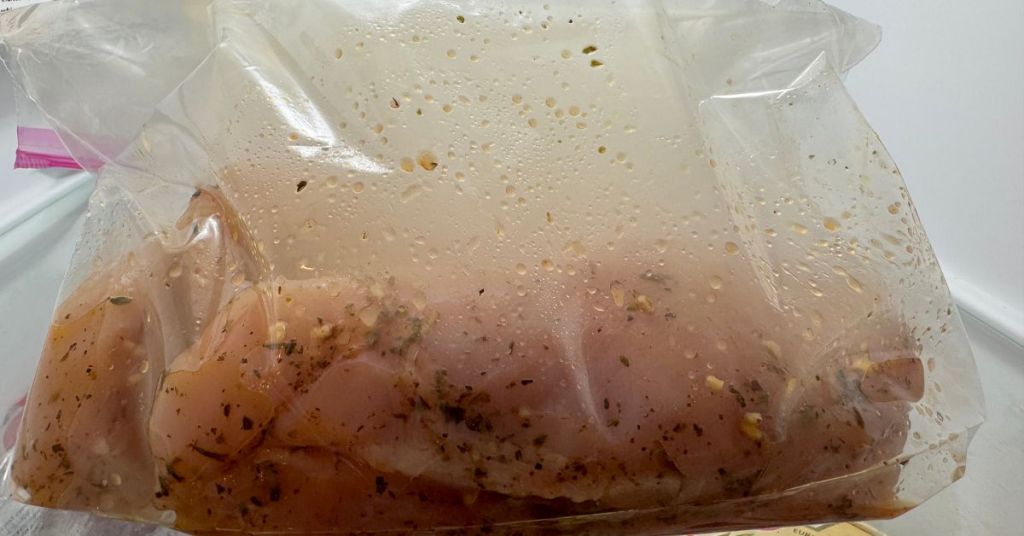 Chicken smoked: marinated breasts with herbs and garlic, ready to cook.