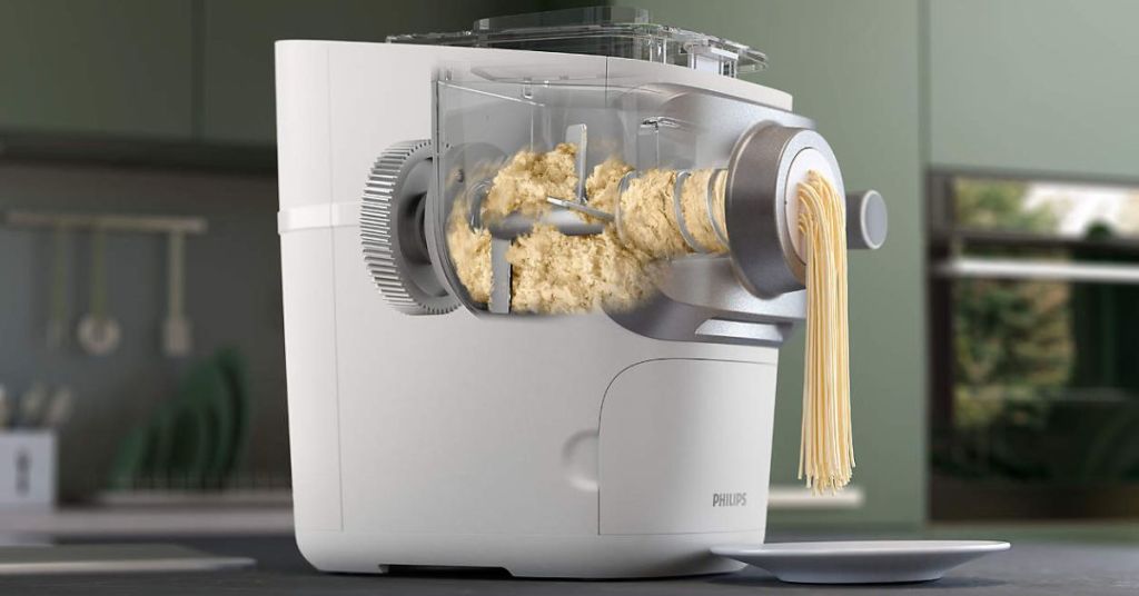 Philips pasta maker extruding fresh spaghetti, showcasing an innovative approach to homemade pasta.